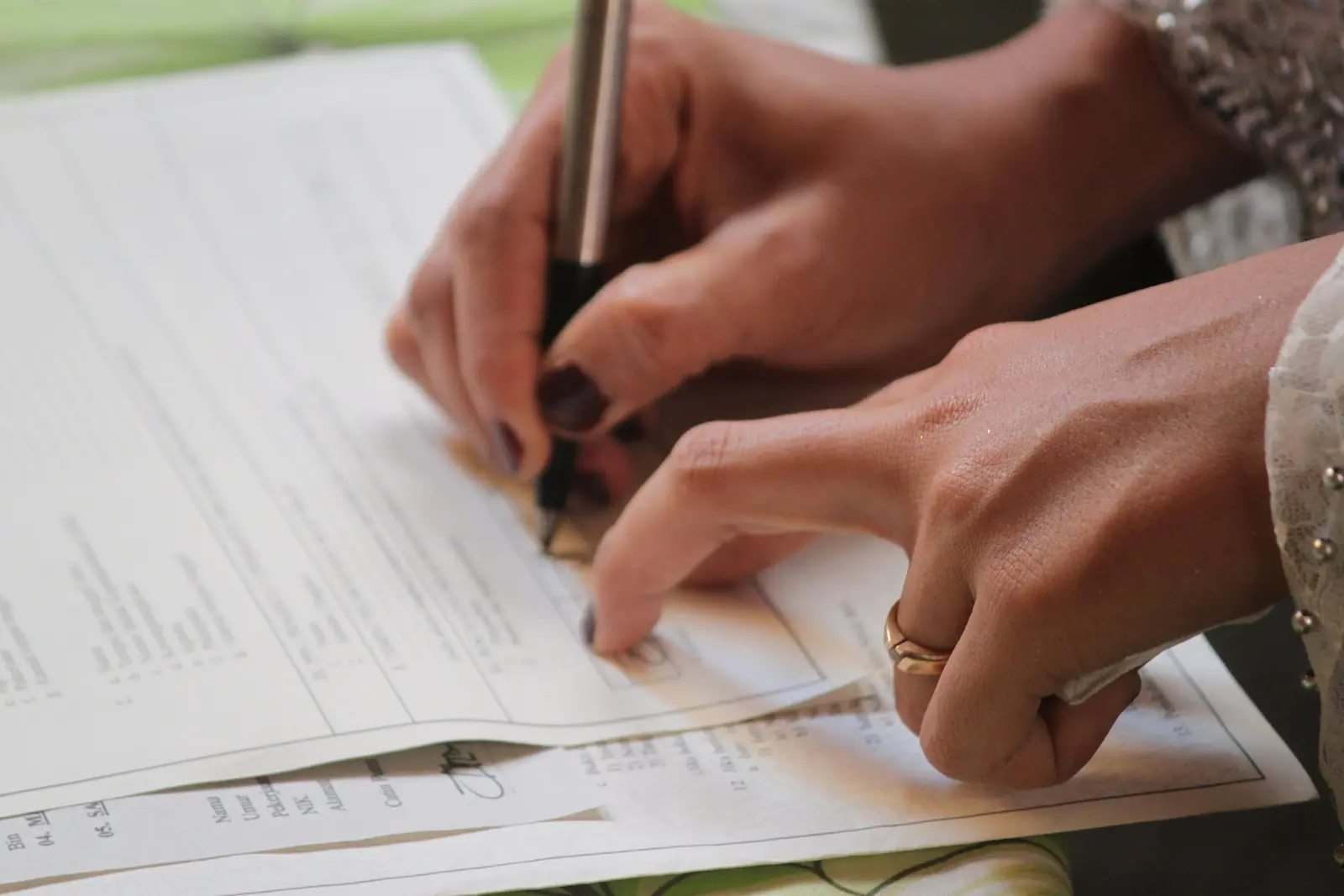 Person signing an injury report form