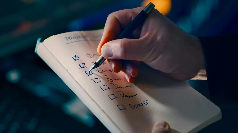 Close-up of a checklist used to review a business sale agreement format