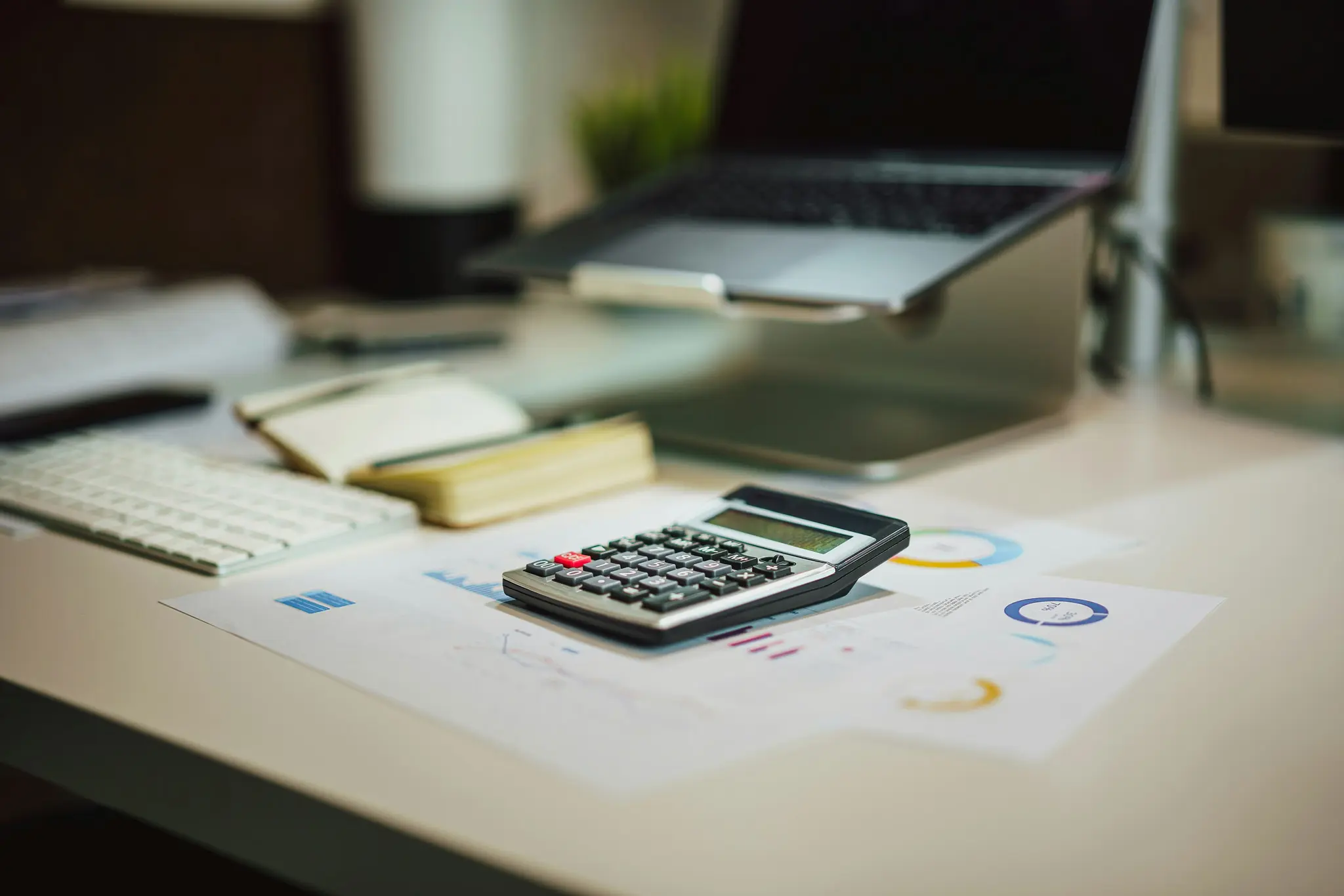 Calculator and documents — an example of calculating the net payout after deductions.