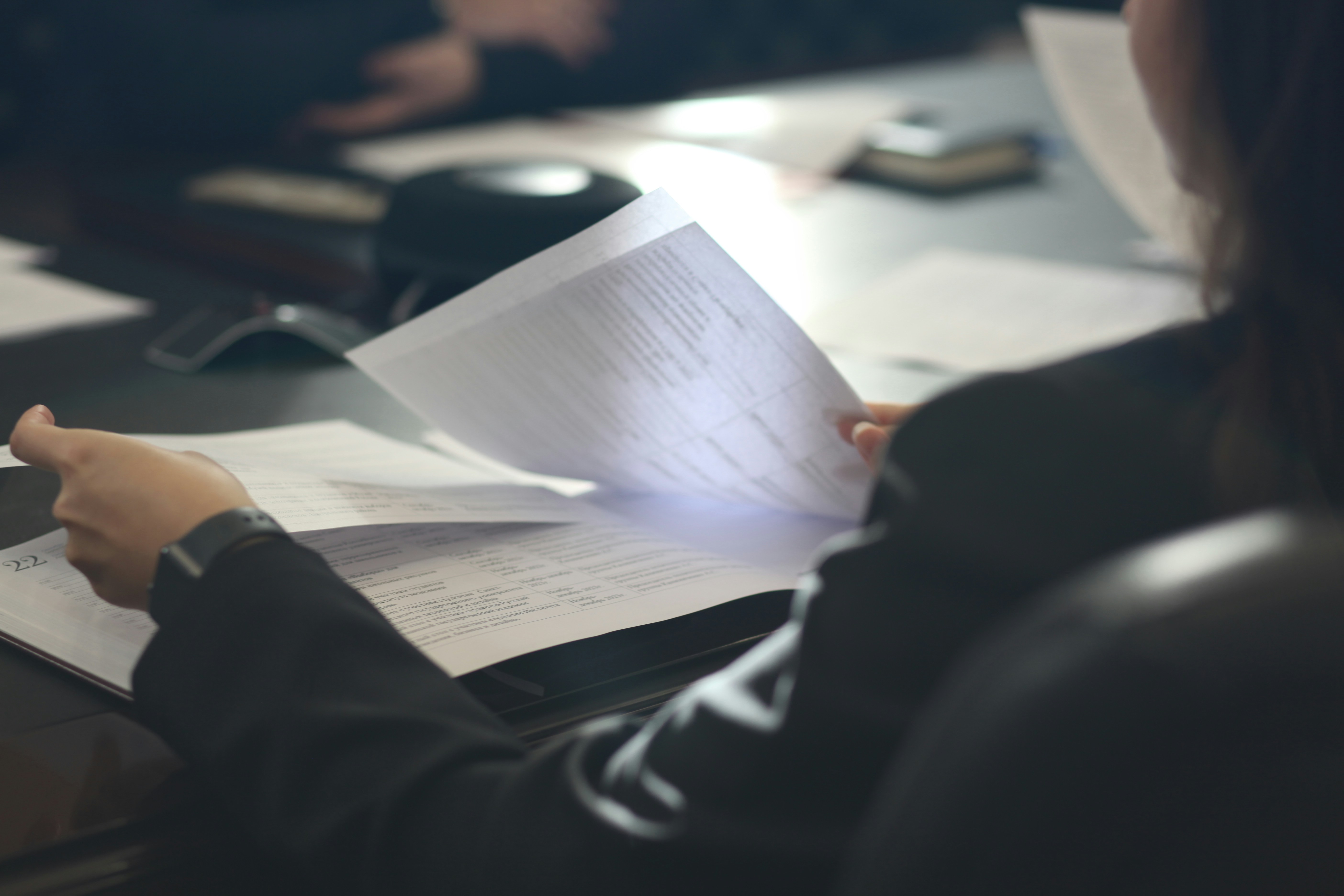 Person reviewing legal documents at a desk