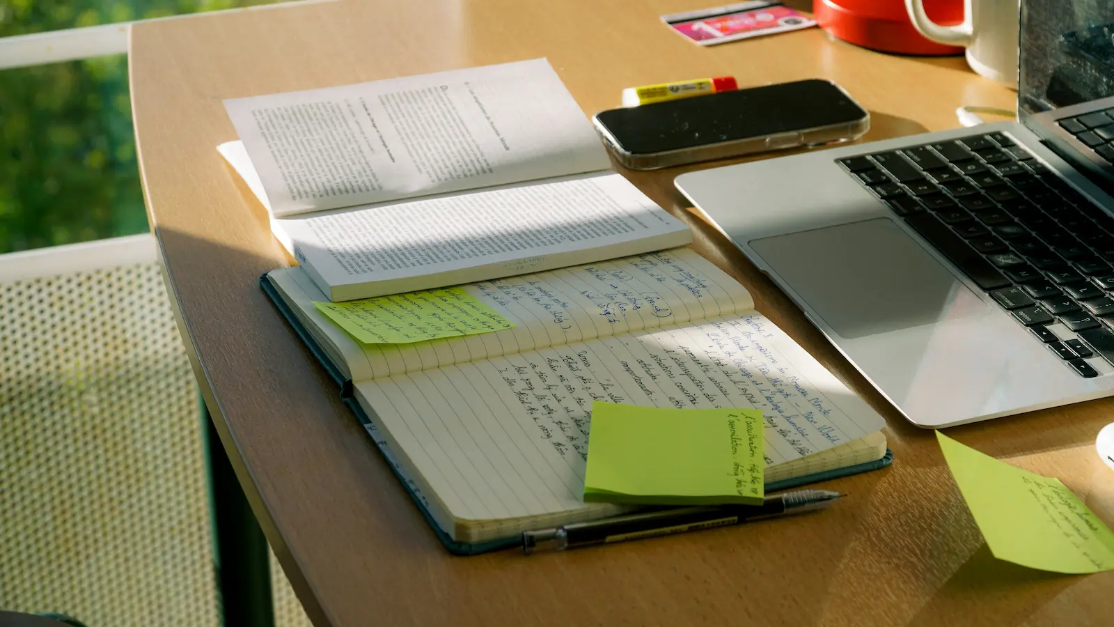 Desk with laptop and notes for drafting DUI letters and forms