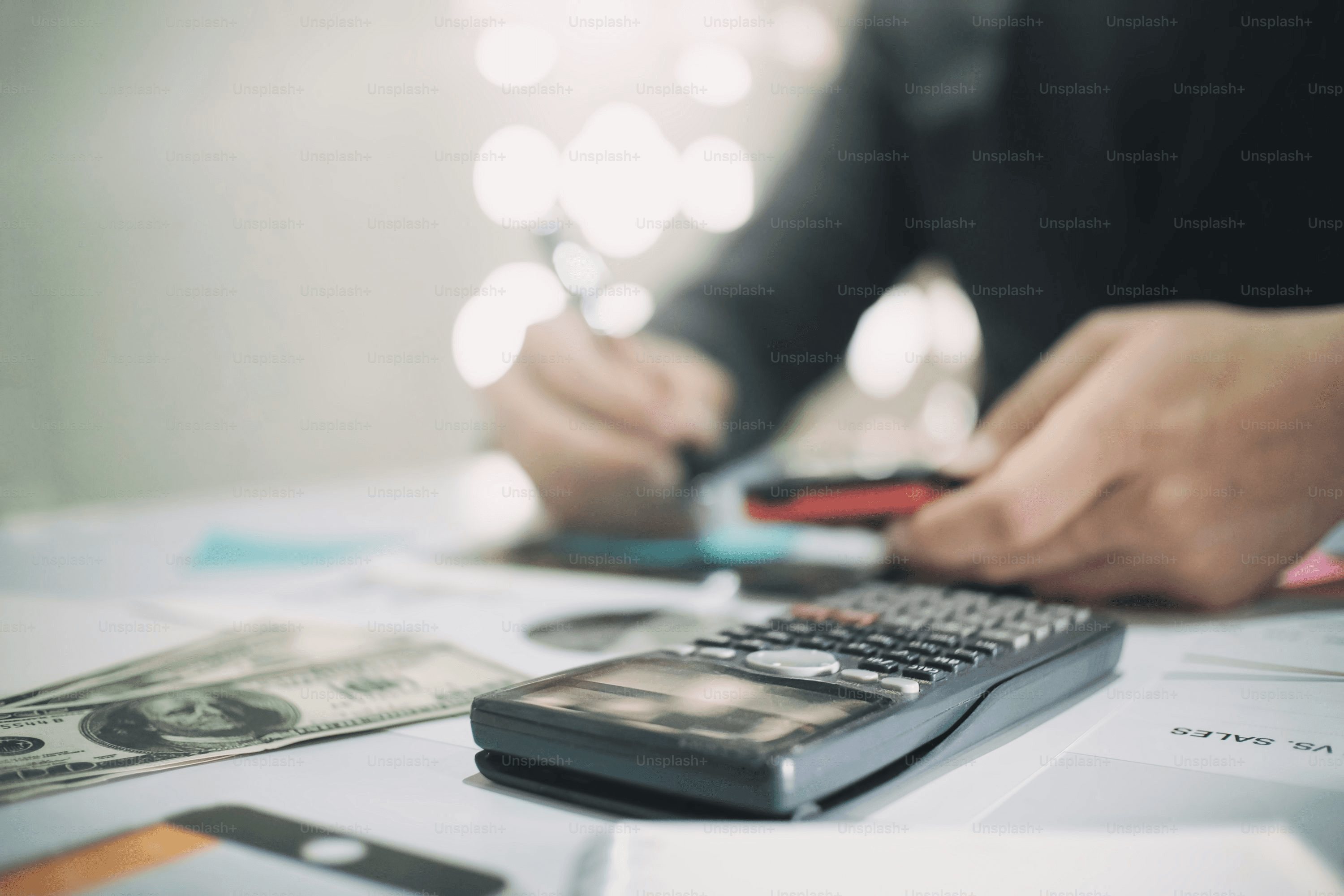 Financial documents and calculator showing probate-related expenses