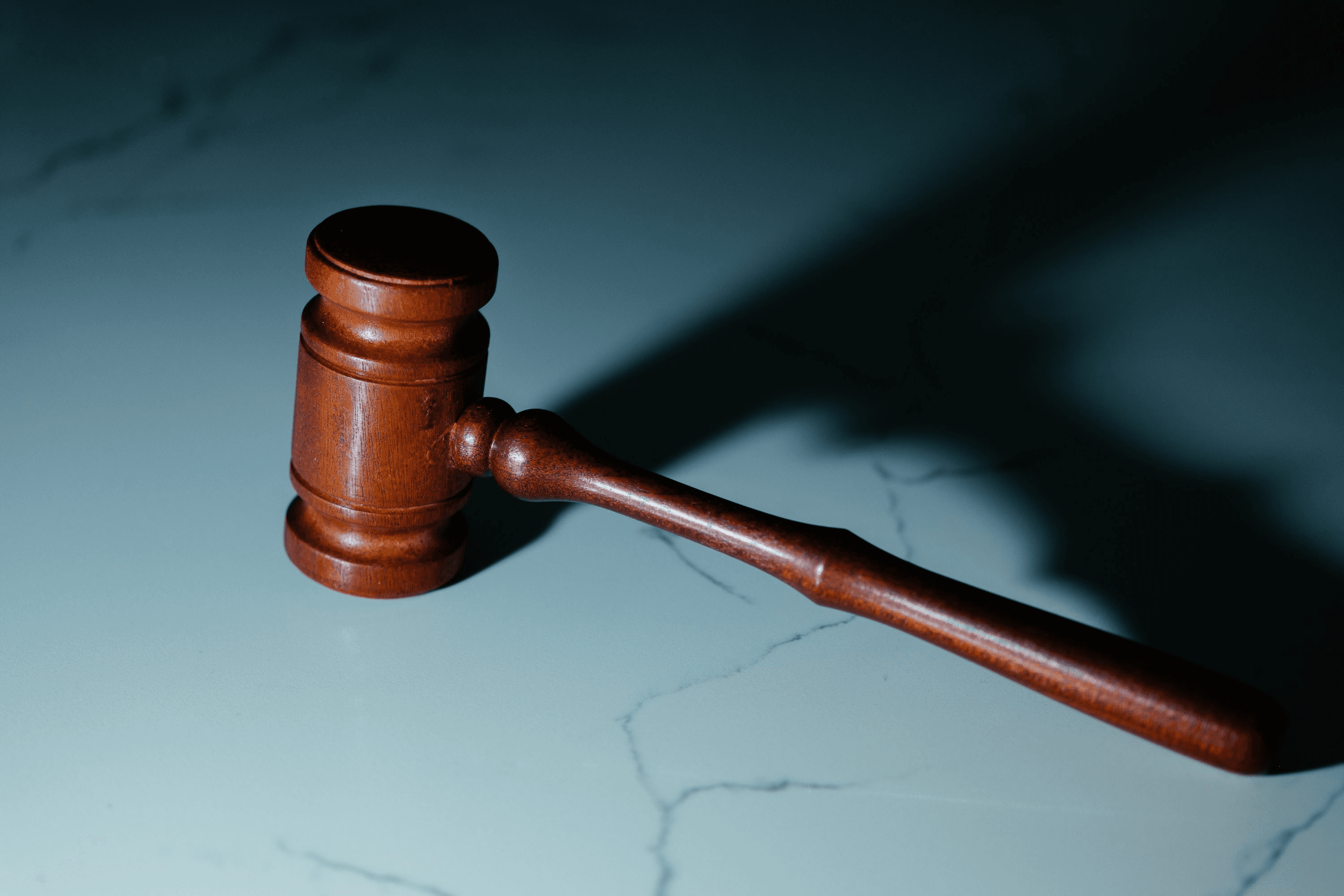 Legal documents, gavel, and notepad on desk - symbolizing criminal defense preparation and legal strategy